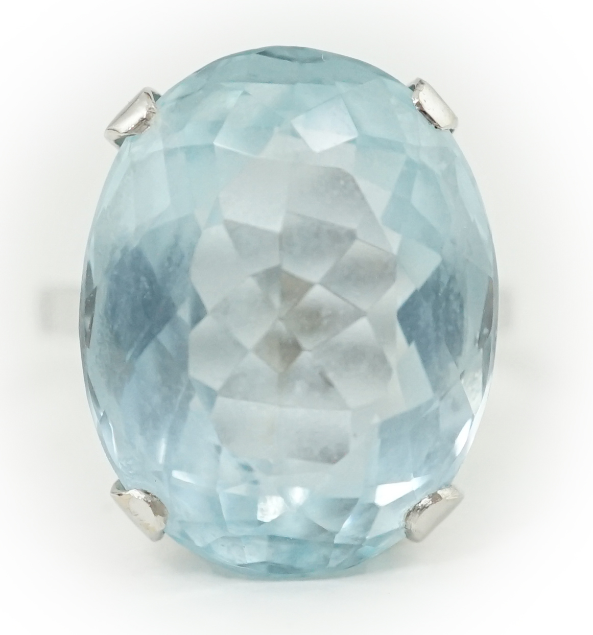 A mid 20th century 18ct white gold and single stone oval cut aquamarine set dress ring